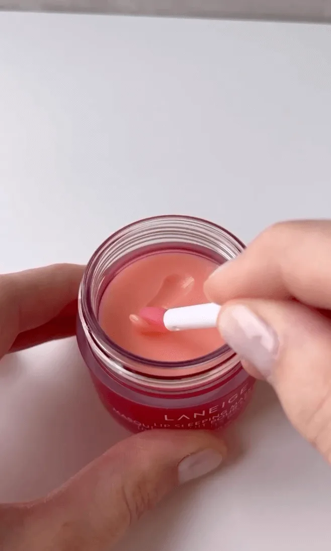 Effective Social Media Content Strategies for 2024. Using the applicator to use the Laneige lip gloss.