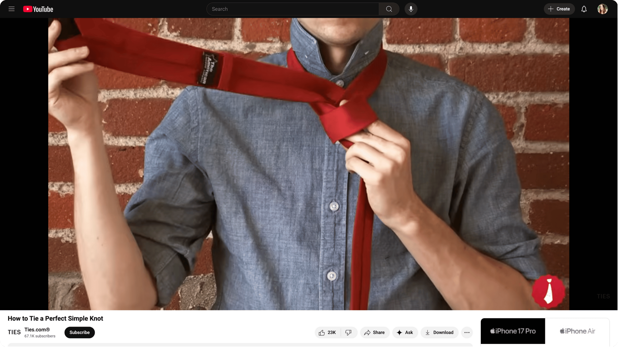 A screenshot of a video tutorial from YouTube on how to tie a tie.