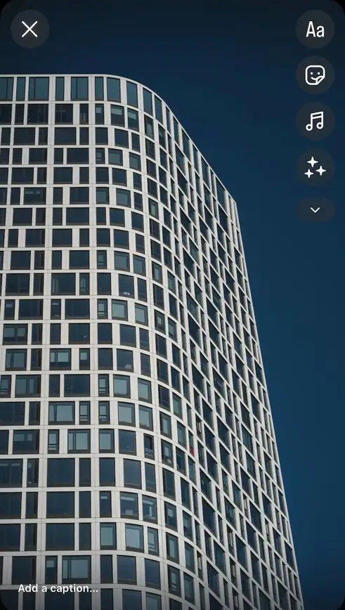 The Instagram Story editor with icons for stickers and other features on the right side.