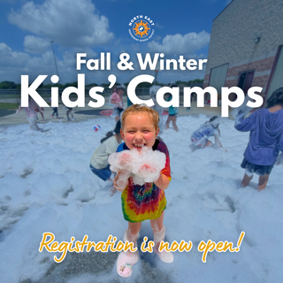 A cheerful child plays with bubbles at a kids' camp. The outdoor scene is lively, with children enjoying a foam activity on a sunny day, promoting the opening of registration for fall and winter camps.