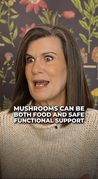 A woman expressing enthusiasm while discussing mushrooms as both a food and functional support. The setting has a vibrant floral wallpaper.