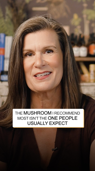 A person discusses an unusual mushroom recommendation with an engaging expression. The setting is cozy, hinting at an informative yet casual talk.