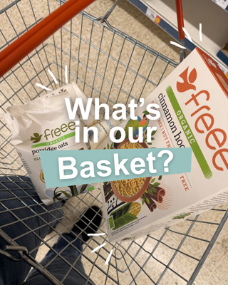 A shopping basket containing organic porridge oats and cinnamon hoops cereal. The image includes a text overlay asking 'What's in our Basket?'